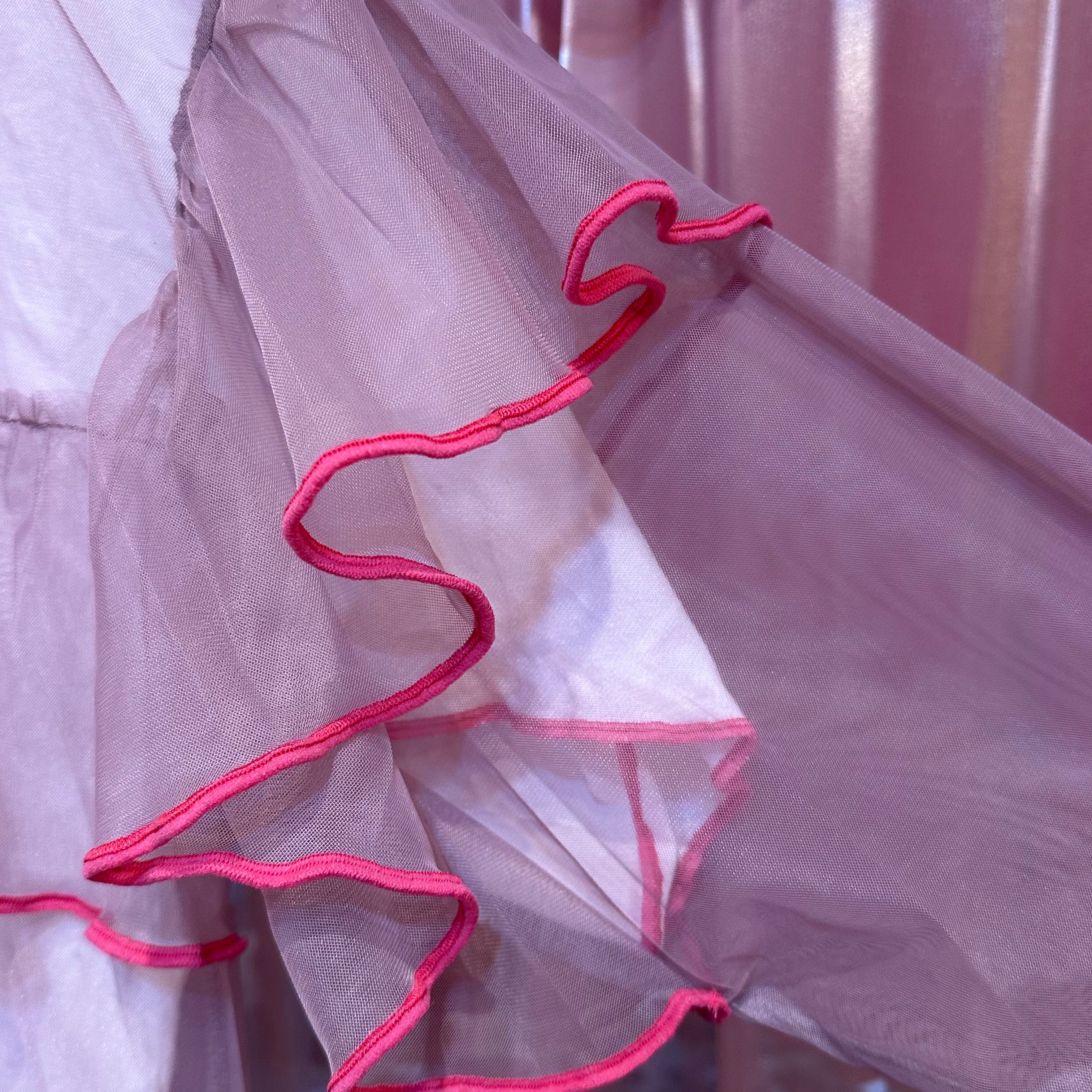 ピンクシアーフリル長袖トップス